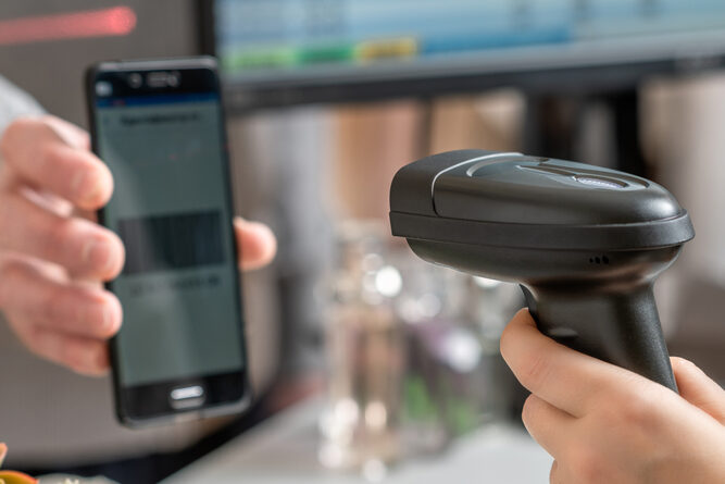 Paying a bill in person by scanning a barcode at a store